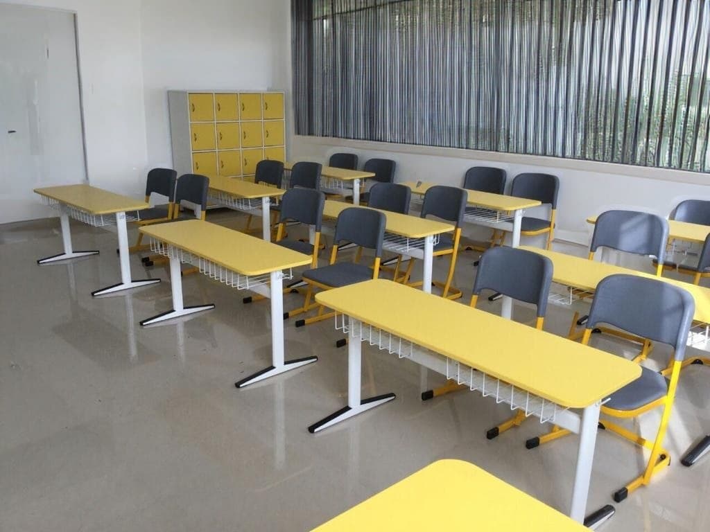Yellow-top twin desks with grey chairs and yellow student lockers — interior concept